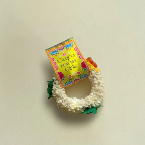 A vibrant assortment of handcrafted FS Gajra Favours for a desi wedding.