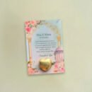 A beautifully wrapped Premium Chocolate Favour with a custom card, placed on an elegant wedding table setting.