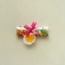 Elegant heart-shaped saunf box with multi-colour sugar-coated fennel seeds, perfect for wedding giveaways.